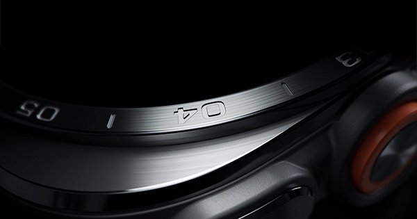 Close-up view of a Galaxy Watch Ultra2 in Titanium Silver showing its exterior design in detail, including Cushion design, refined bezel, sculpted edge and side buttons.